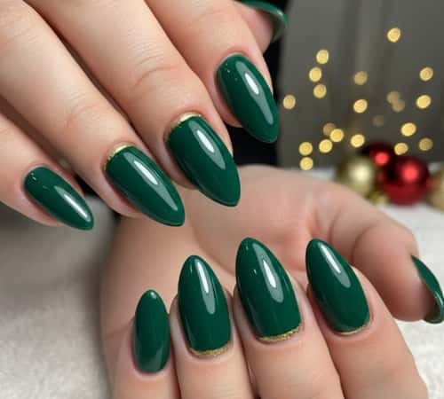 1. Emerald Gloss Almond Nails with Gold Cuticles