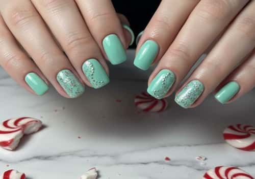 13. Mint Green Glitter Swirl Nails
